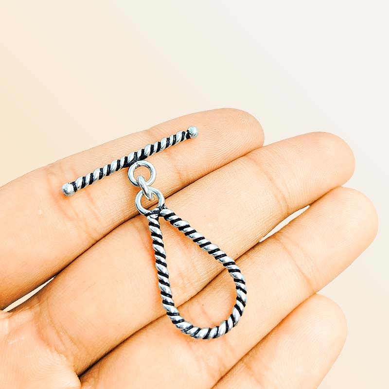 Elegant Silver Overlay teardrop rope toggle clasp with twisted loop and polished bar design, perfect for necklaces and bracelets, handcrafted in India.