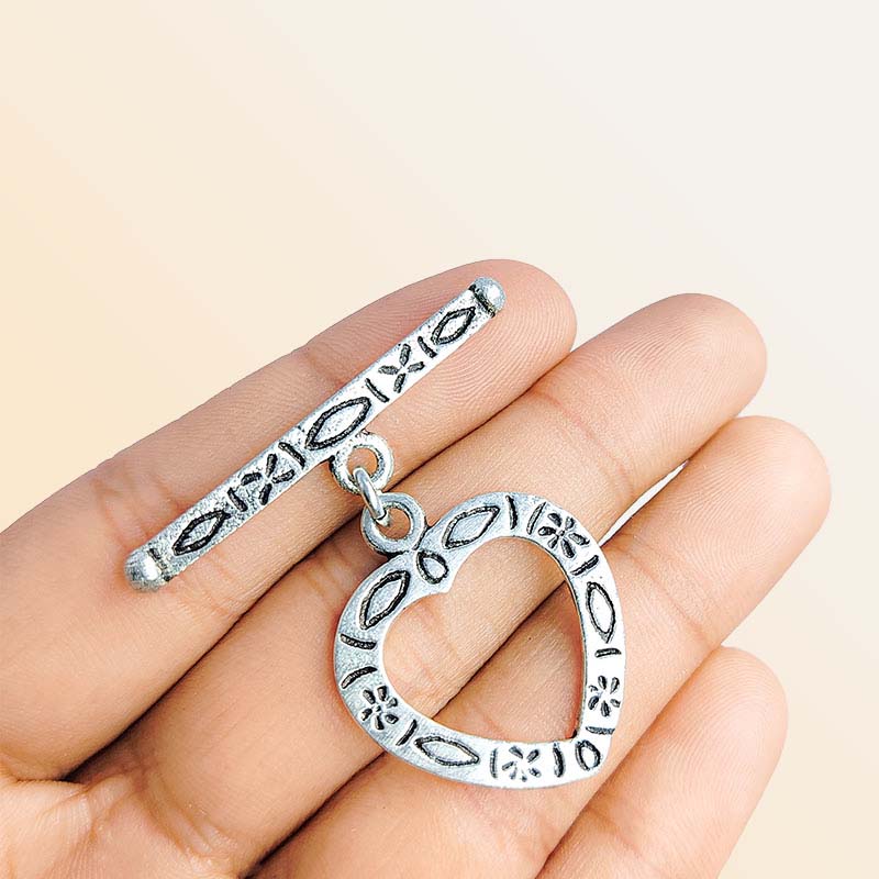 Elegant Silver Overlay floral heart toggle clasp with engraved heart-shaped loop and polished bar design, perfect for necklaces and bracelets, handcrafted in India.