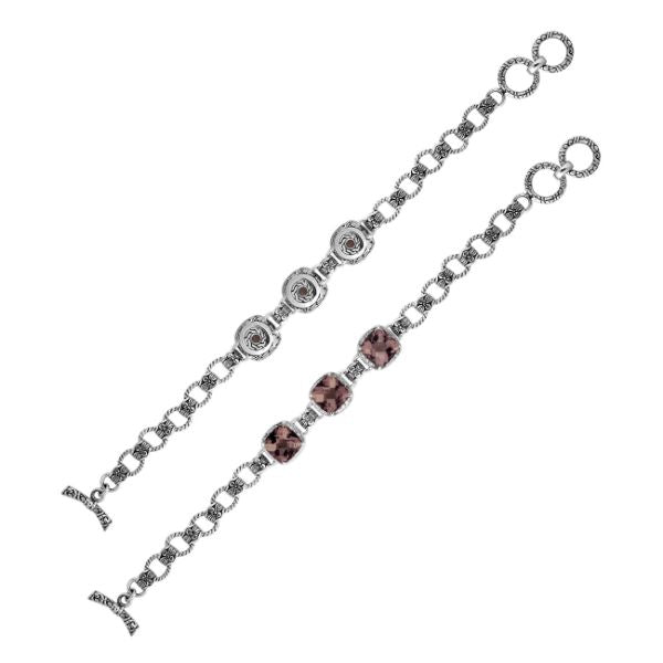 Retail sterling silver bracelet featuring earthy Smokey Quartz stones set in ornate Balinese frames with textured chain details and a smooth toggle lock for elegant everyday styling.