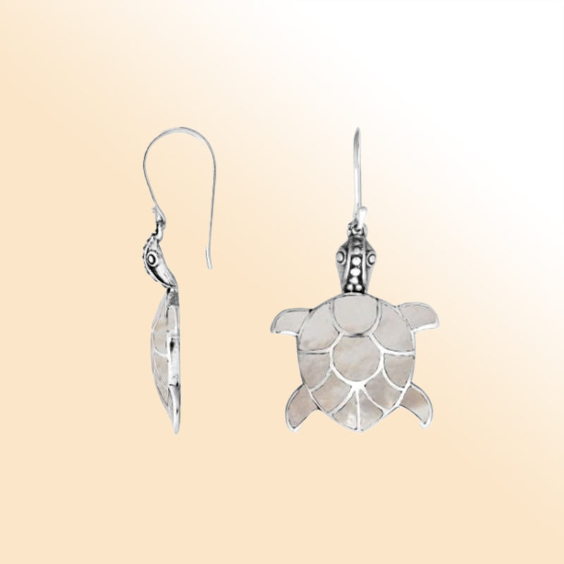 Sterling silver turtle earrings with shimmering mother of pearl inlay and artisan silver detailing