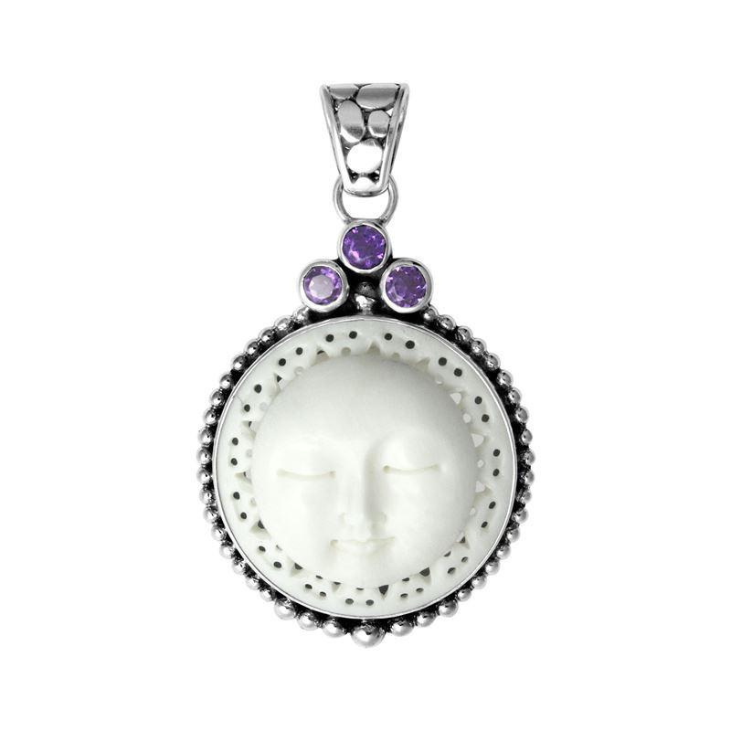 Handmade sterling silver Balinese pendant with carved bone moon face and Amethyst Quartz accents.