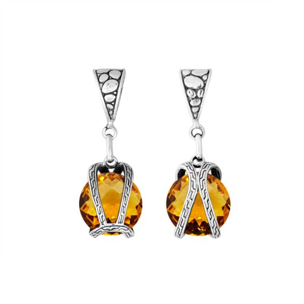 An elegant sterling silver pendant featuring a glowing Citrine Quartz in a handcrafted dual rope frame, designed with Balinese artistry and fine detail.