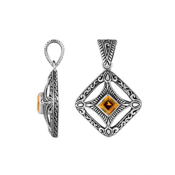 An elegant sterling silver pendant featuring a glowing Citrine Quartz in a handcrafted Balinese filigree frame, radiating artistry and timeless elegance.