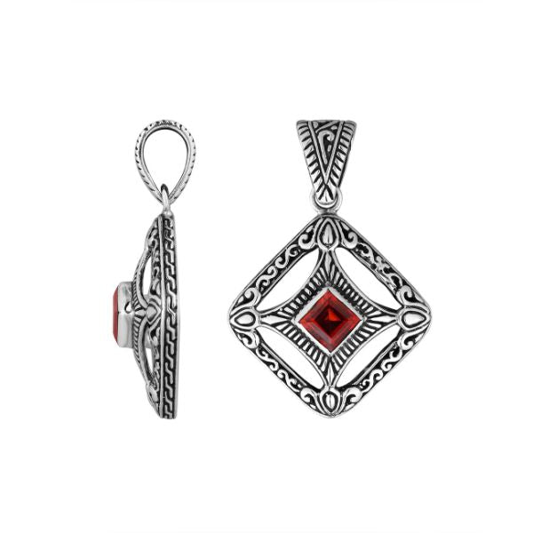 An elegant sterling silver pendant featuring a deep Red Garnet Quartz in a detailed Balinese filigree frame, handcrafted with intricate artistry and shine.