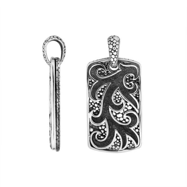 Artistic sterling silver rectangle pendant with swirl carved design and texture.