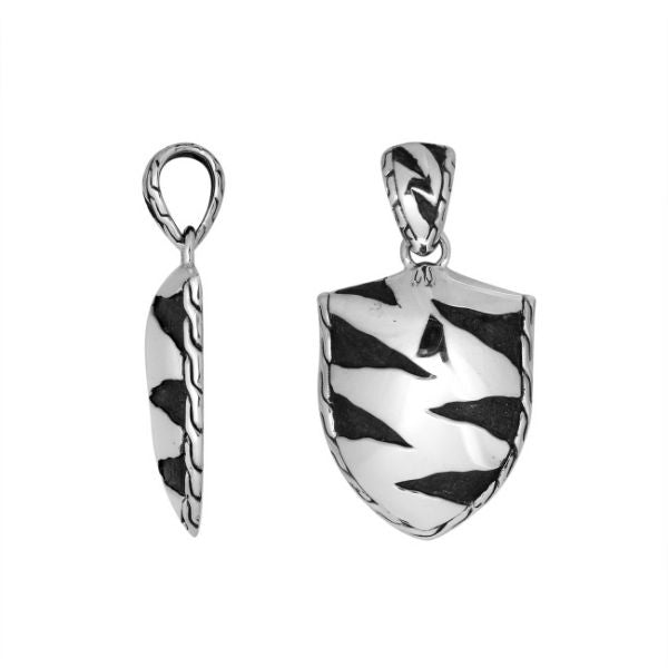 Artistic sterling silver shield pendant with oxidized wavy carved detailing.