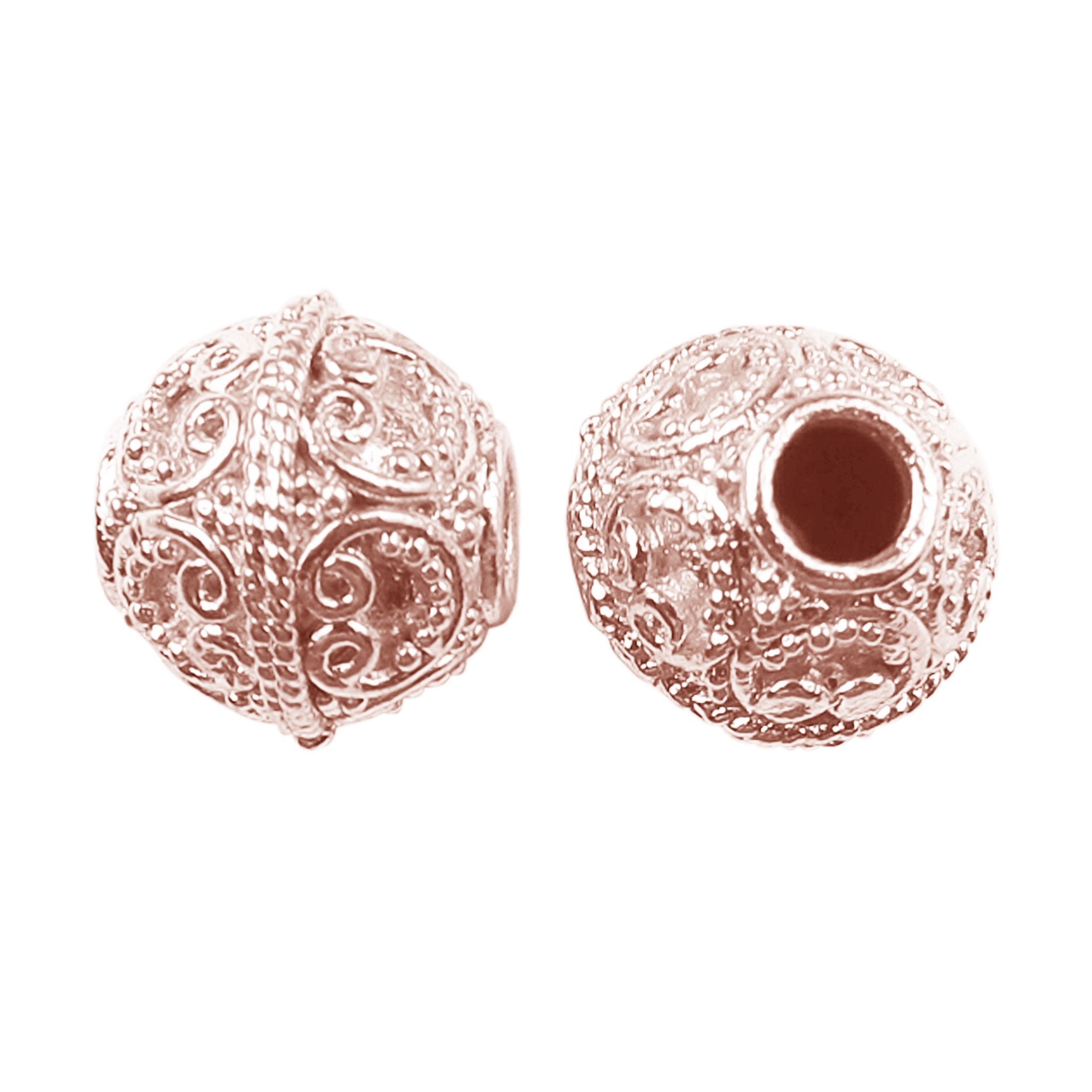 Ornate rose gold overlay copper scroll bead handcrafted in India for jewelry designs