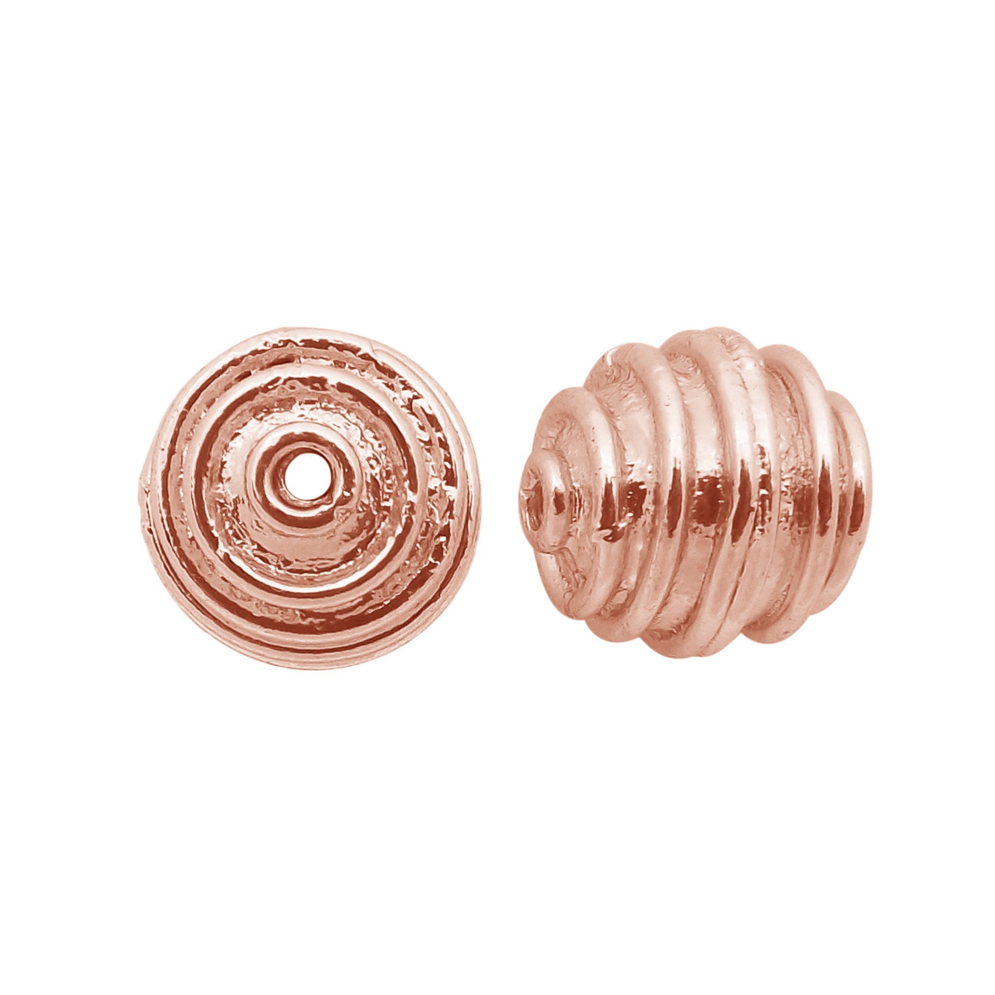 Rose gold ribbed copper bead handcrafted in India with polished finish and rounded shape