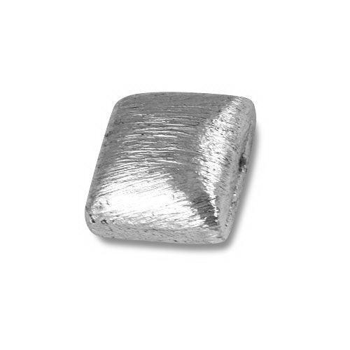 Modern silver geometric bead with textured finish, handcrafted in India using silver overlay over copper.