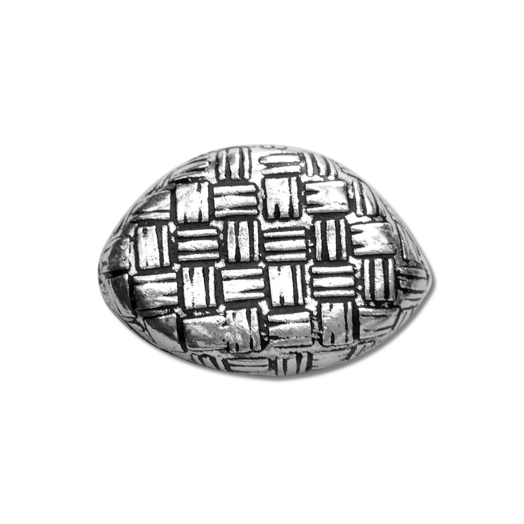 Silver oval bead cap from India with geometric textured design, handcrafted using silver overlay over copper.