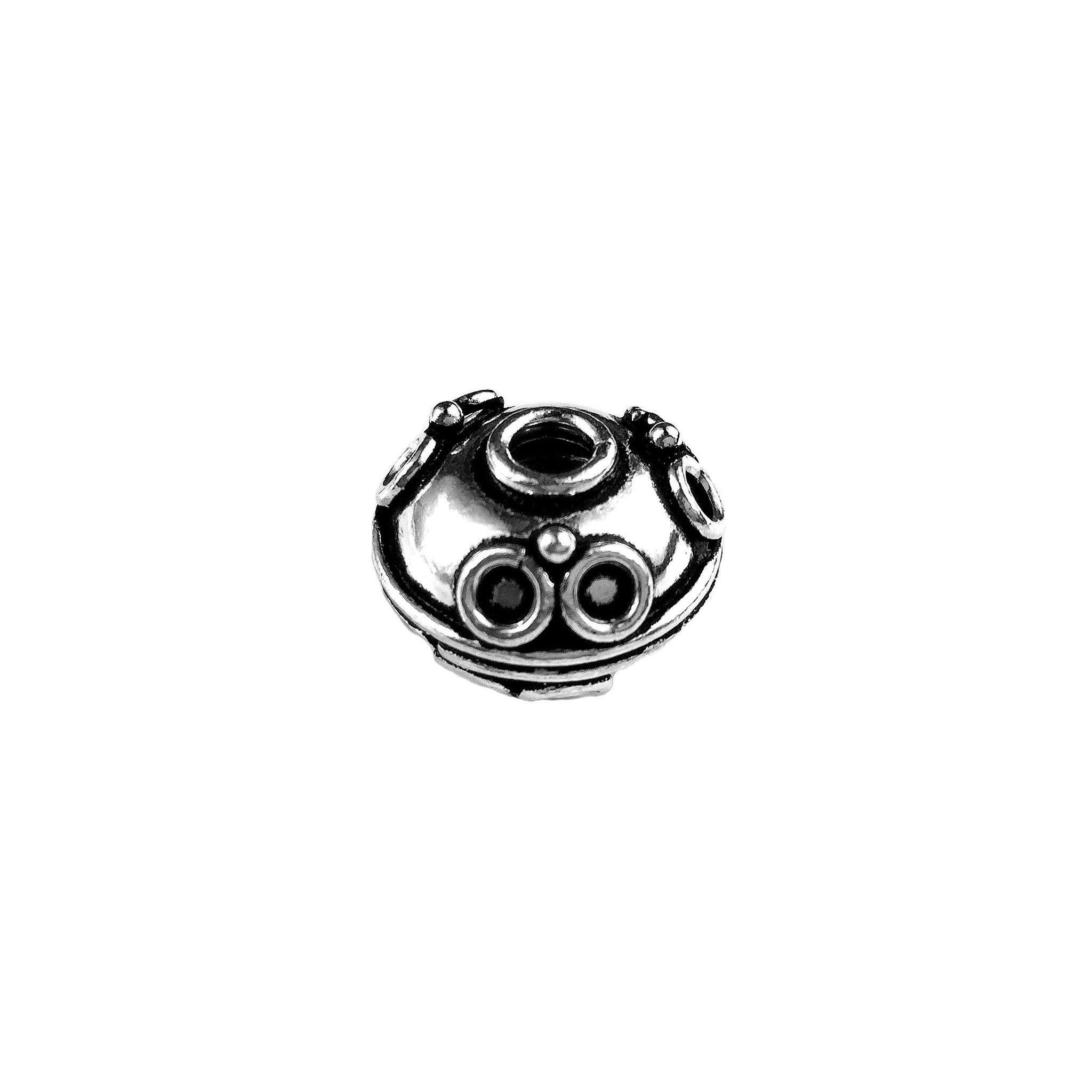 Decorative silver overlay over copper dome bead handcrafted in India with raised circular design
