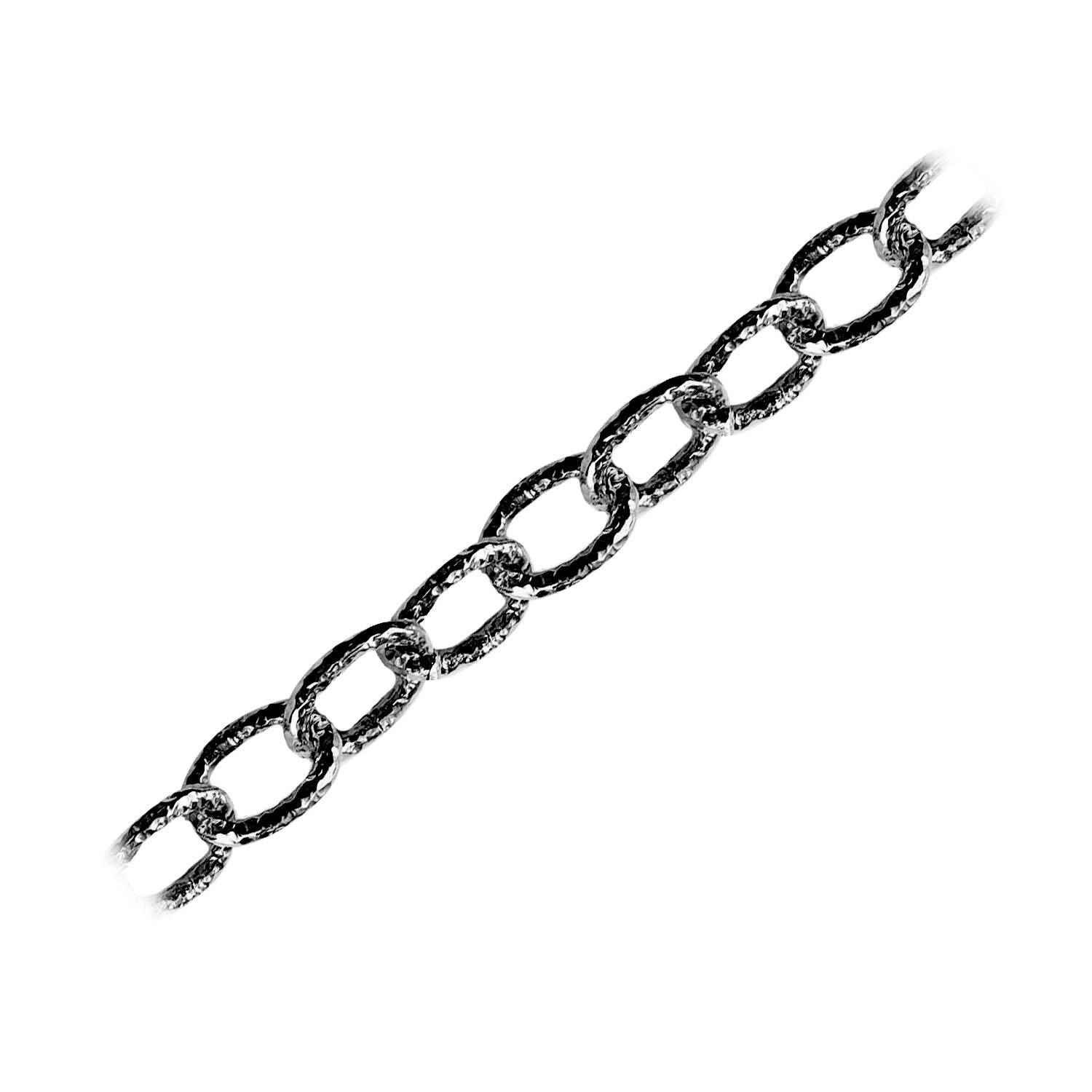 Oversized oval link chain made with Black Rhodium Overlay Over Copper featuring bold elongated textured links, polished dark finish, and flexible length sold per foot for statement jewelry styling