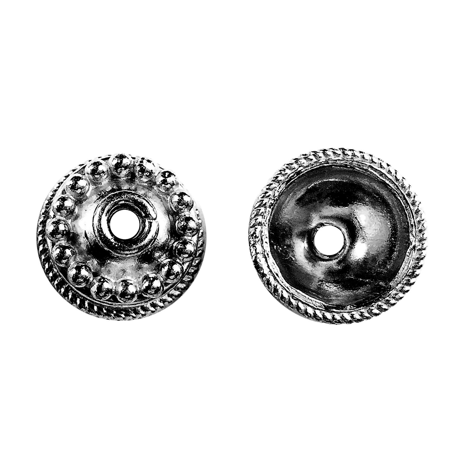 Detailed view of handcrafted black rhodium overlay over copper decorative jewelry caps with ornate beading, made in India.
