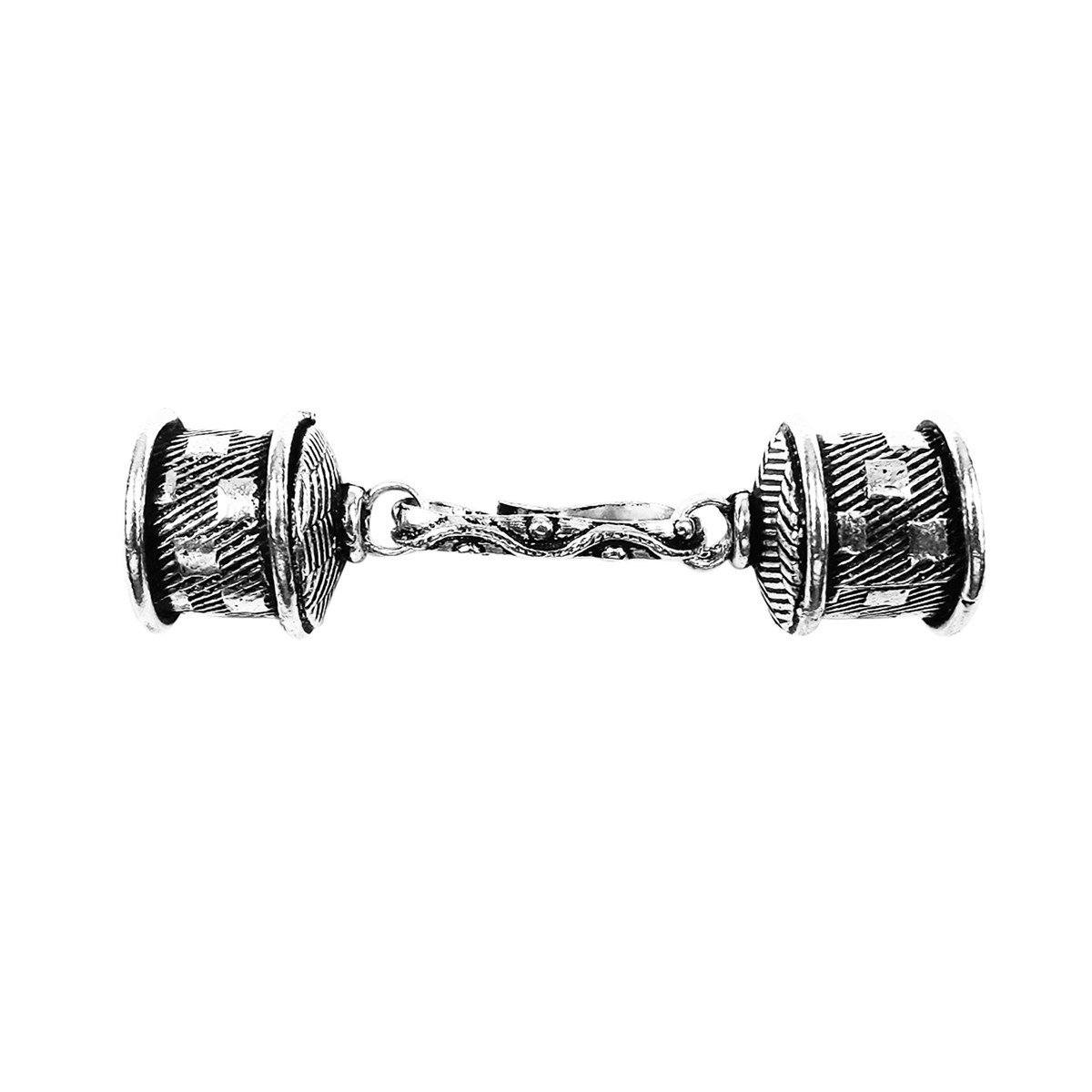 Handcrafted silver overlay over copper barrel connector from India with textured ends and decorative center link