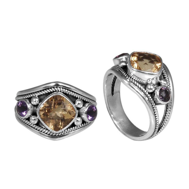 Sterling silver harmony ring with Citrine Quartz and Amethyst Quartz accents, handcrafted in Bali.