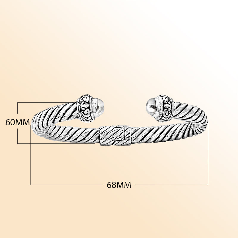 Handcrafted sterling silver cable cuff Bang with ornate dome ends in Bali artisan design"e 