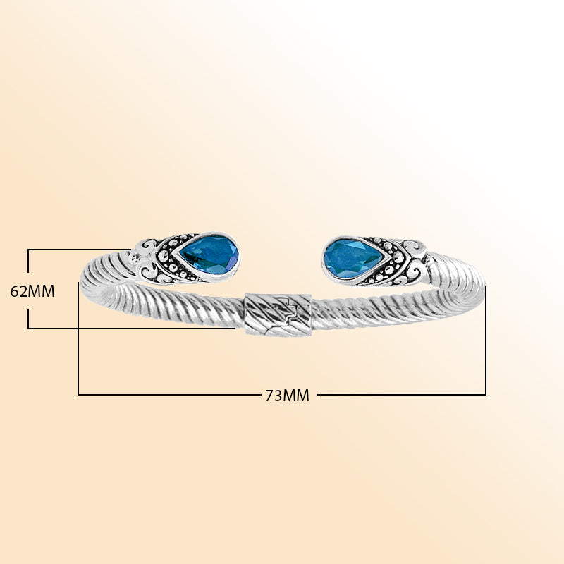 "Handmade sterling silver Blue Topaz Bali cuff bracelet with rope twist design and Quartz accents"