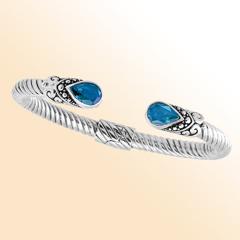 "Handmade sterling silver Blue Topaz Bali cuff bracelet with rope twist design and Quartz accents"