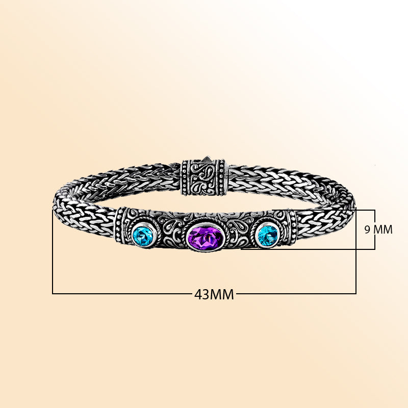 Handcrafted silver woven bracelet with blue and purple quartz stones in Balinese design.