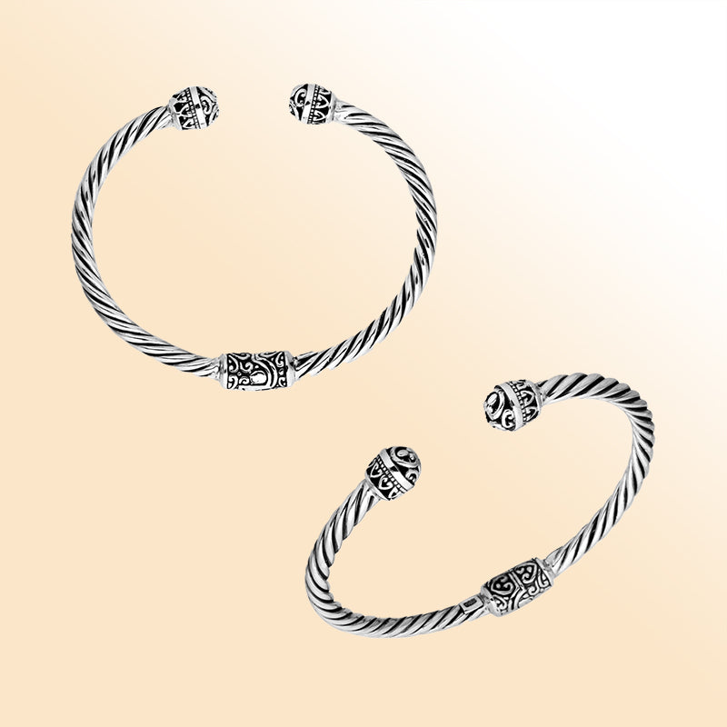 Sterling silver cuff bangle with twisted rope design and intricate Balinese end motifs, handmade in Bali.