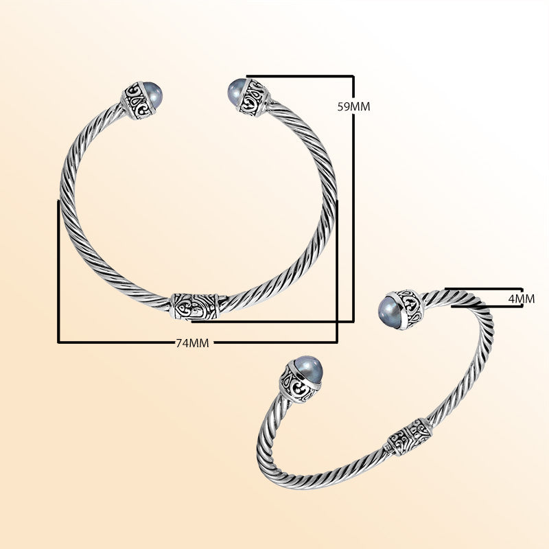 Sterling silver cuff bangle with luminous gray pearls and Balinese detailing, handmade in Bali.