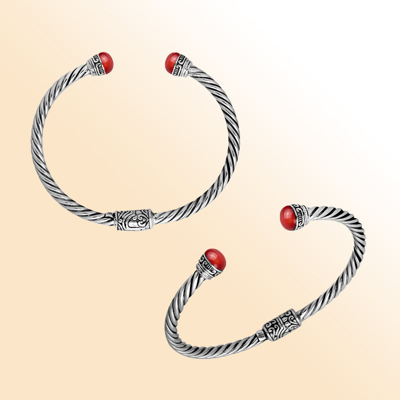 Sterling silver cuff bangle with luminous red coral cabochons and Balinese detailing, handmade in Bali.