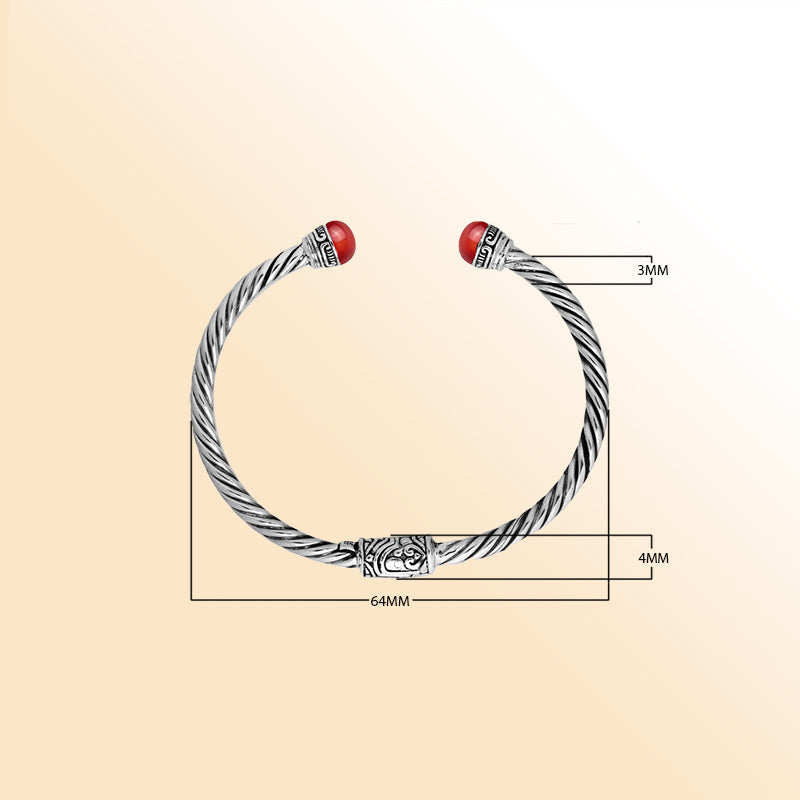 Sterling silver cuff bangle with luminous red coral cabochons and Balinese detailing, handmade in Bali.