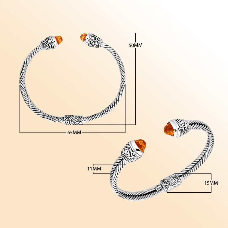 Handcrafted Bali sterling silver bangle featuring Citrine Quartz ends with ornate Balinese detailing, elegant open cuff design.