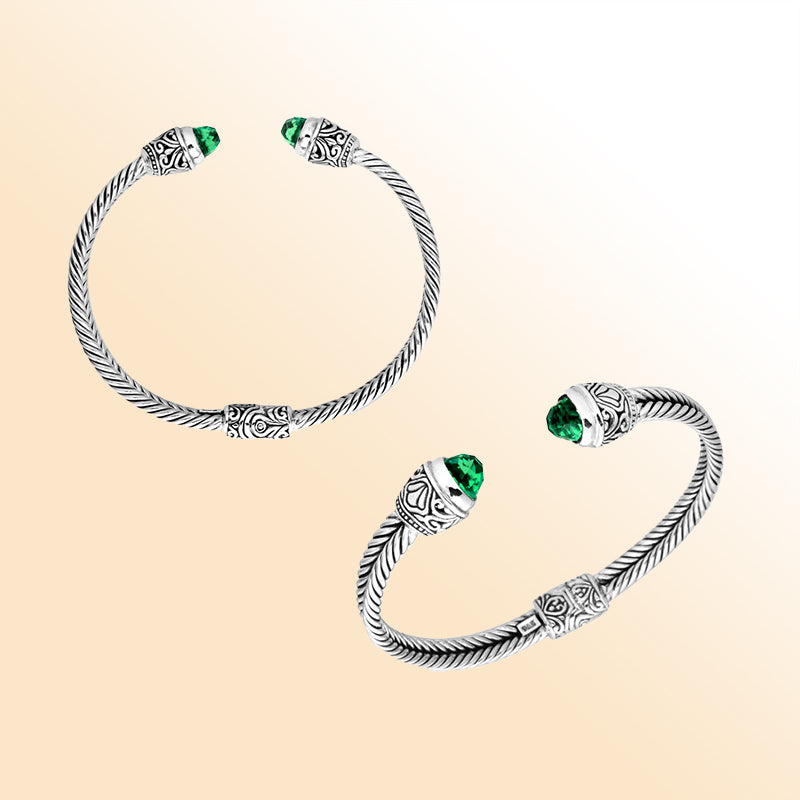 Handcrafted Bali silver bangle with rope design, featuring Green Quartz ends and ornate Balinese detailing.