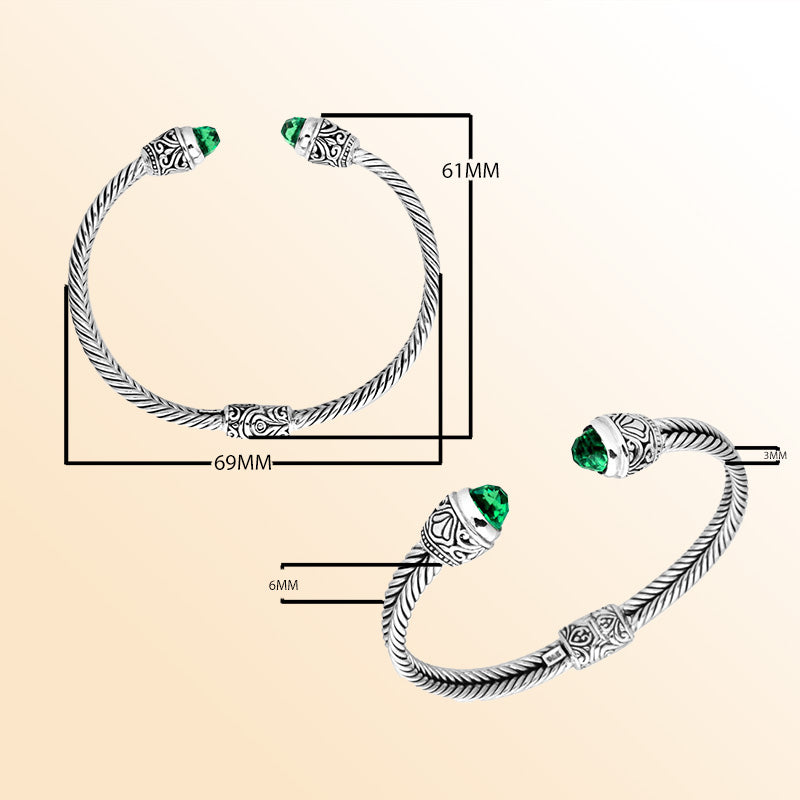 Handcrafted Bali silver bangle with rope design, featuring Green Quartz ends and ornate Balinese detailing.