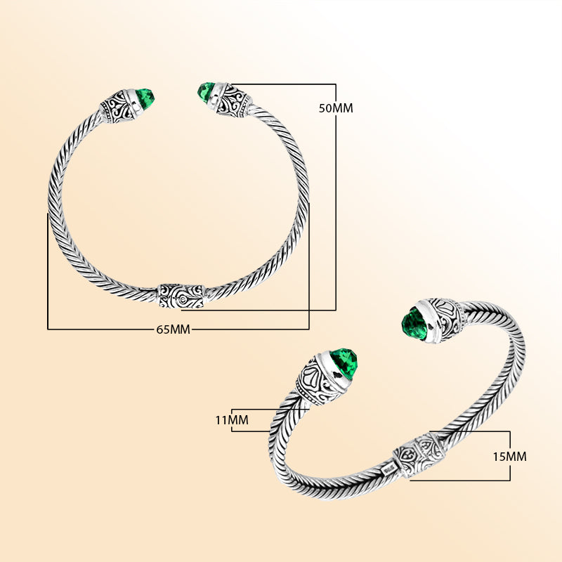 Handcrafted Bali silver bangle with rope design, featuring Green Quartz ends and ornate Balinese detailing.