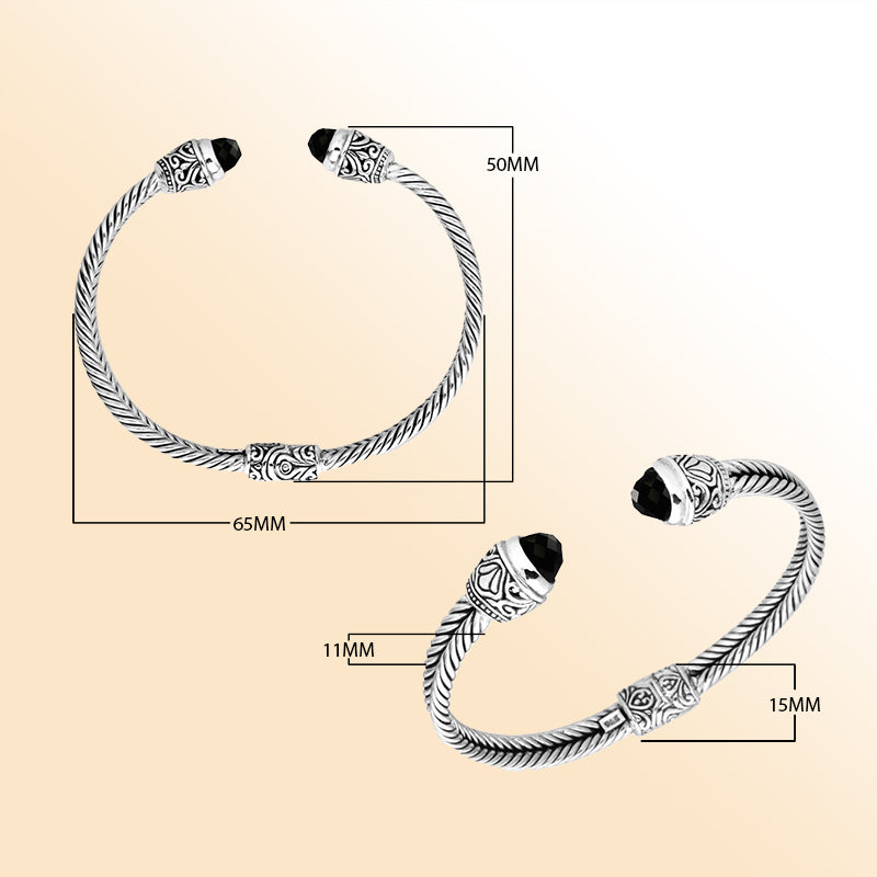 Handcrafted Bali sterling silver bangle featuring Black Onyx accents with ornate Balinese motifs, adjustable open cuff design.
