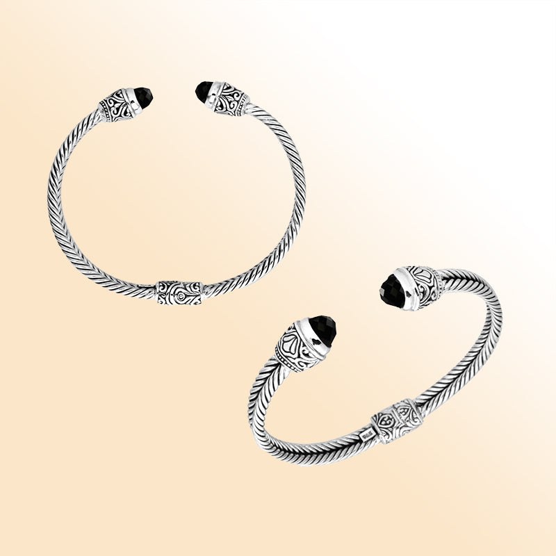 Handcrafted Bali sterling silver bangle featuring Black Onyx accents with ornate Balinese motifs, adjustable open cuff design.