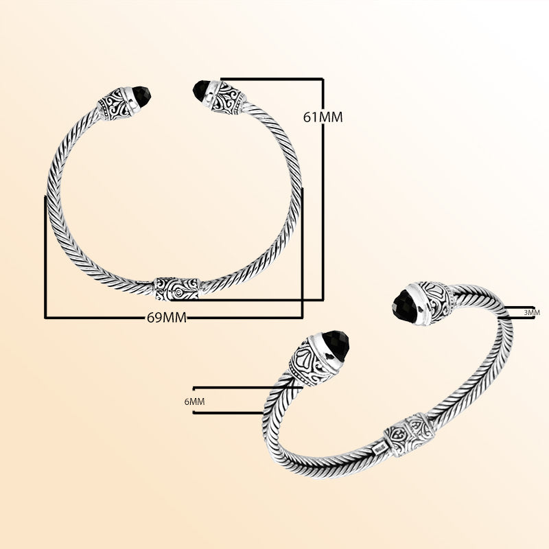 Handcrafted Bali sterling silver bangle featuring Black Onyx accents with ornate Balinese motifs, adjustable open cuff design.