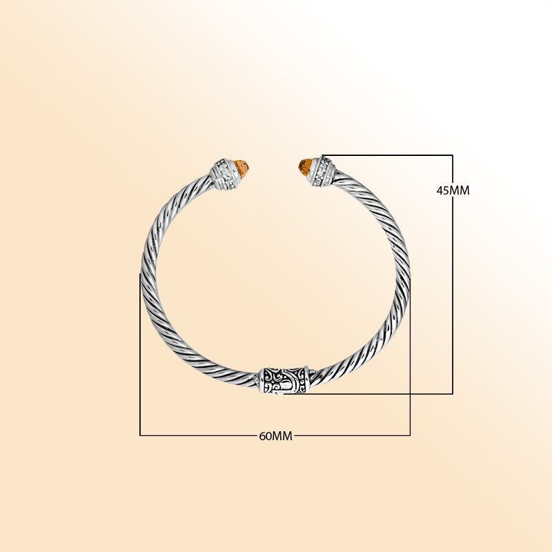Handcrafted Bali sterling silver bangle featuring Citrine Quartz and Cubic Zirconia accents, rope-style design with ornate detailing.