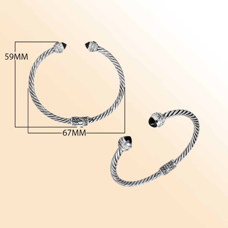 Handcrafted Bali sterling silver bangle featuring Black Onyx and Cubic Zirconia, rope-style design with ornate detailing.