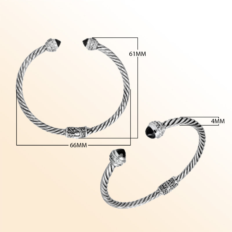 Handcrafted Bali sterling silver bangle featuring Black Onyx and Cubic Zirconia, rope-style design with ornate detailing.