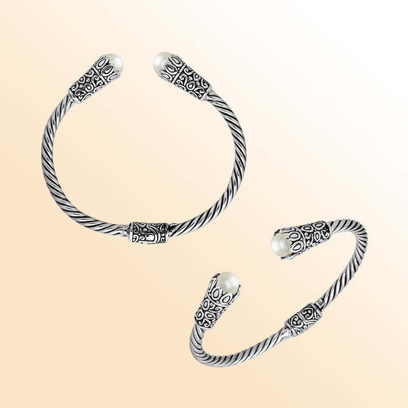 Handmade pearl silver bangle with twisted cable design and Balinese carvings