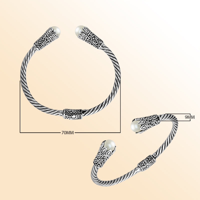 Handmade pearl silver bangle with twisted cable design and Balinese carvings