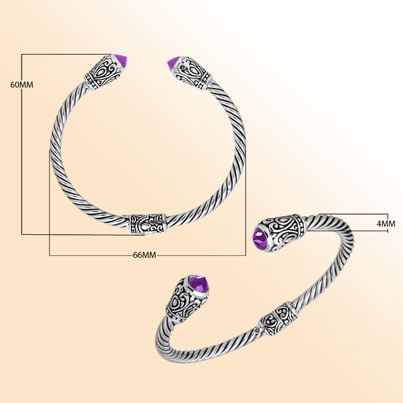 Handmade silver bangle with amethyst quartz ends and Balinese carved design