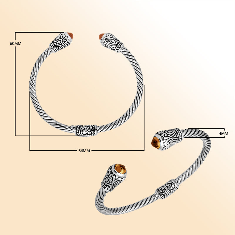 Handmade silver bangle with citrine quartz ends and Balinese carved design