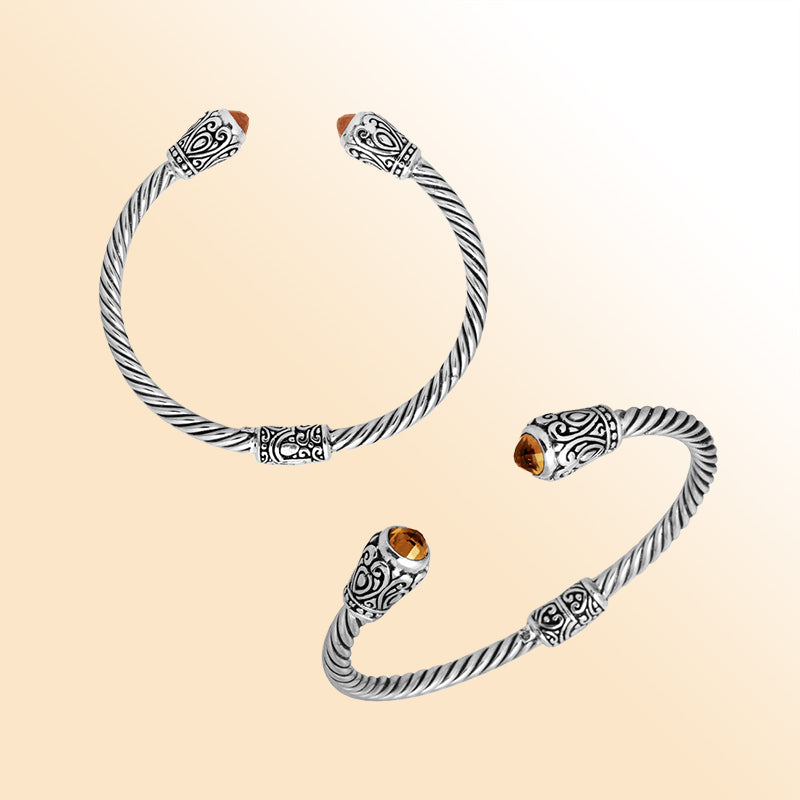 Handmade silver bangle with citrine quartz ends and Balinese carved design