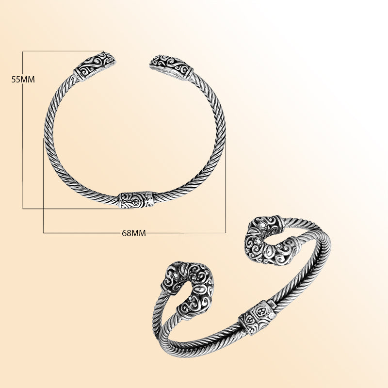 Handmade silver bangle with cubic zirconia ends and Balinese carved design