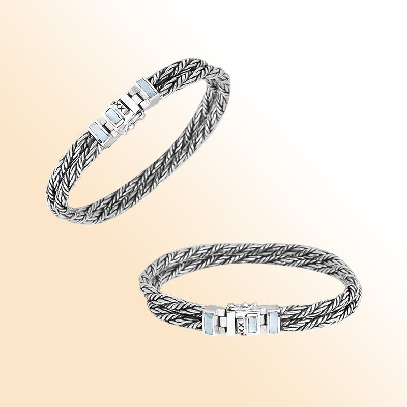 Sterling silver double-braided bracelet with Mother of Pearl inlay clasp, shown in two angles on white background.