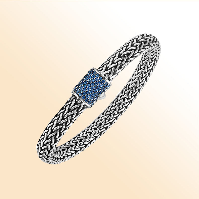 Sterling silver handcrafted Bali bracelet with Blue Topaz Quartz stone clasp and oxidized polish.