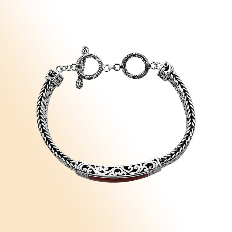 Handcrafted sterling silver bracelet with Coral inlay and toggle lock made in Bali.