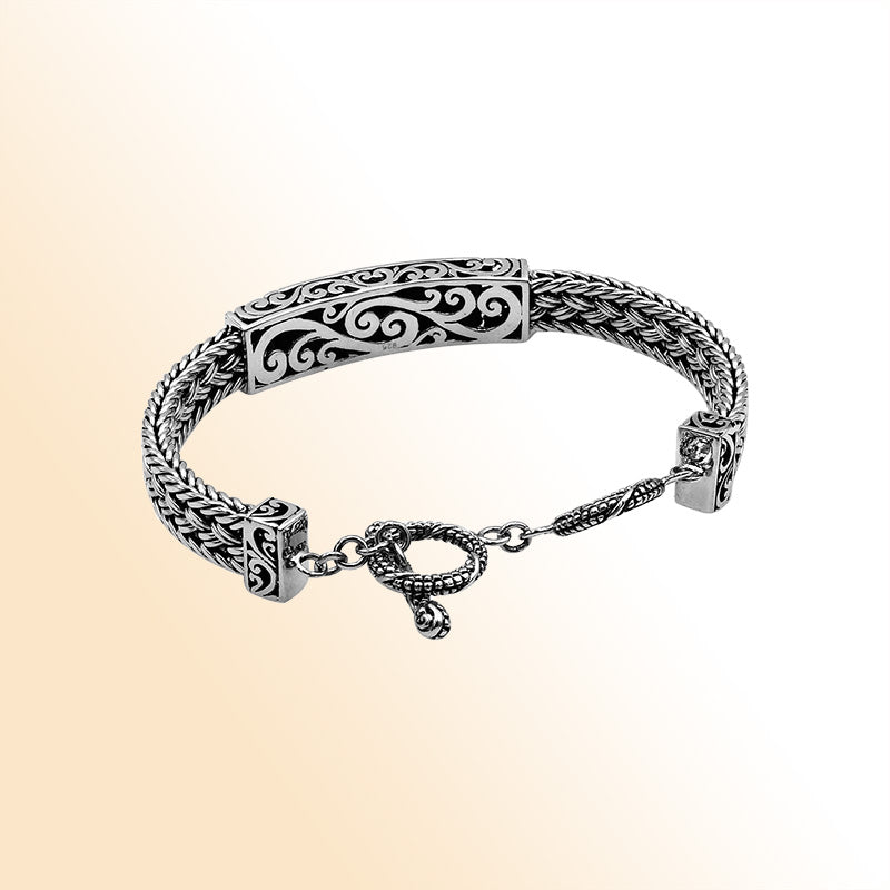 Handcrafted sterling silver bracelet with Coral inlay and toggle lock made in Bali.