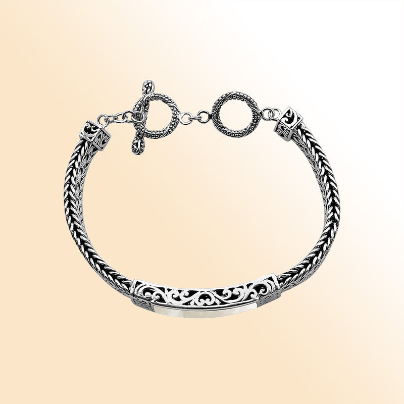 Handcrafted sterling silver bracelet with Mother Of Pearl inlay and toggle lock made in Bali.