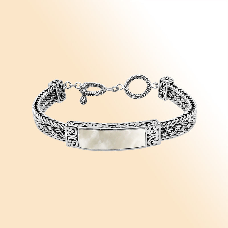 Handcrafted sterling silver bracelet with Mother Of Pearl inlay and toggle lock made in Bali.