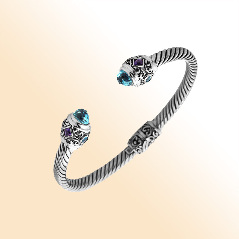 Handcrafted sterling silver bangle with Blue Topaz Quartz and Amethyst Quartz stones made in Bali.